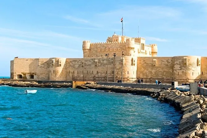 An expansive view of the 15th-century Qaitbay Citadel standing on the Mediterranean coast where the Lighthouse of Alexandria once stood.