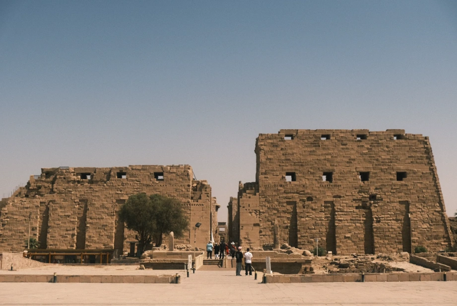 Massive stone pylon entrance at historic Luxor temples